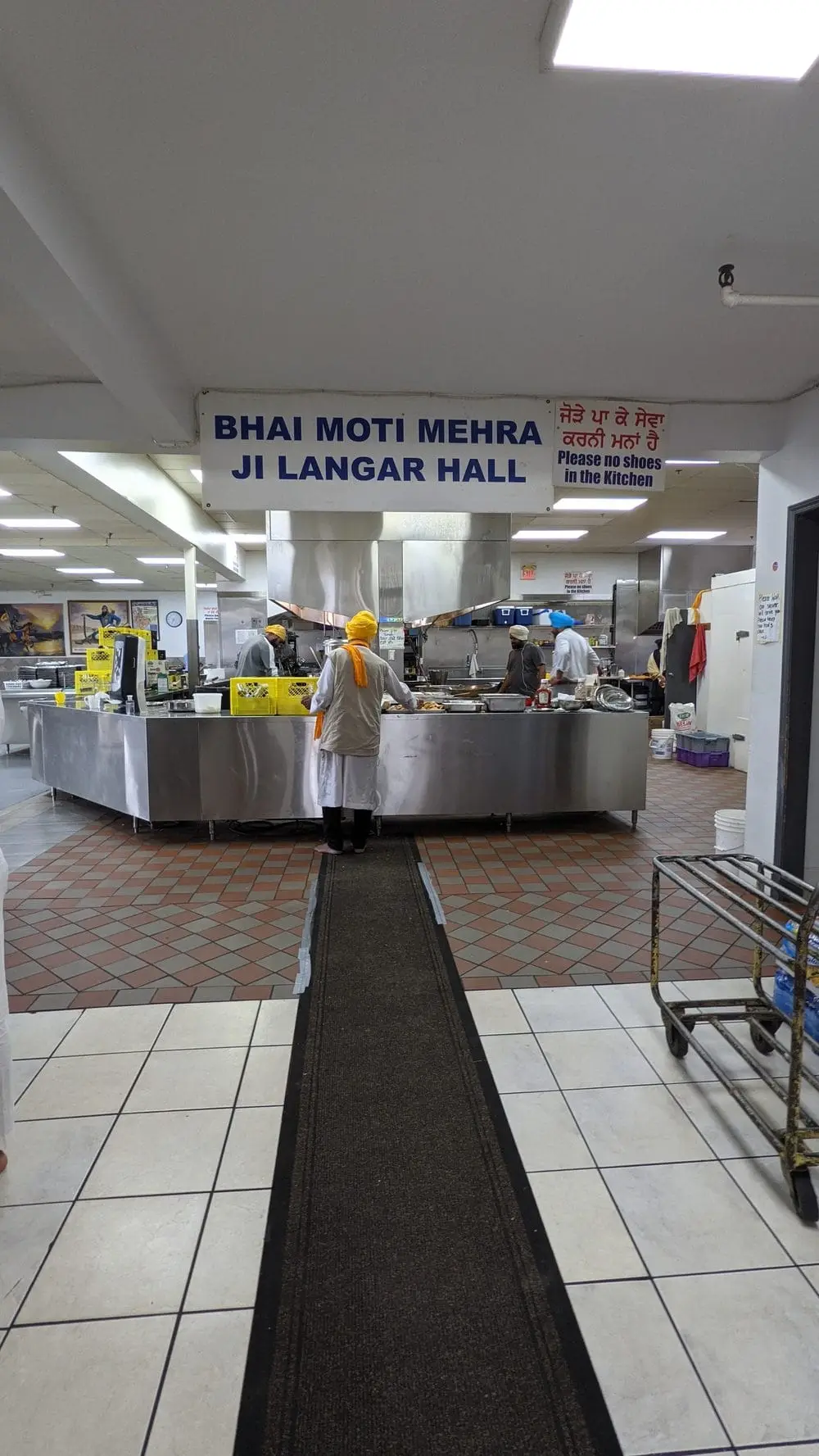 Stainless steel serving counters in the Langar hall kitchen.
