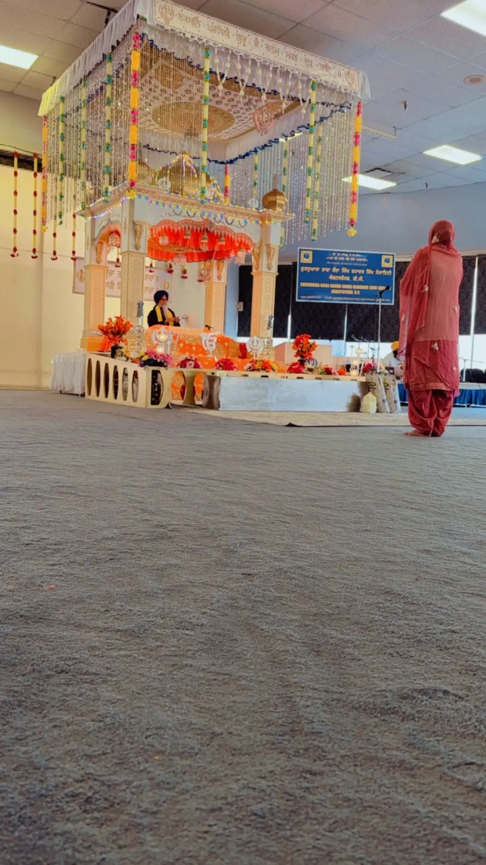 Carpet-level perspective facing the decorated front of the prayer hall.