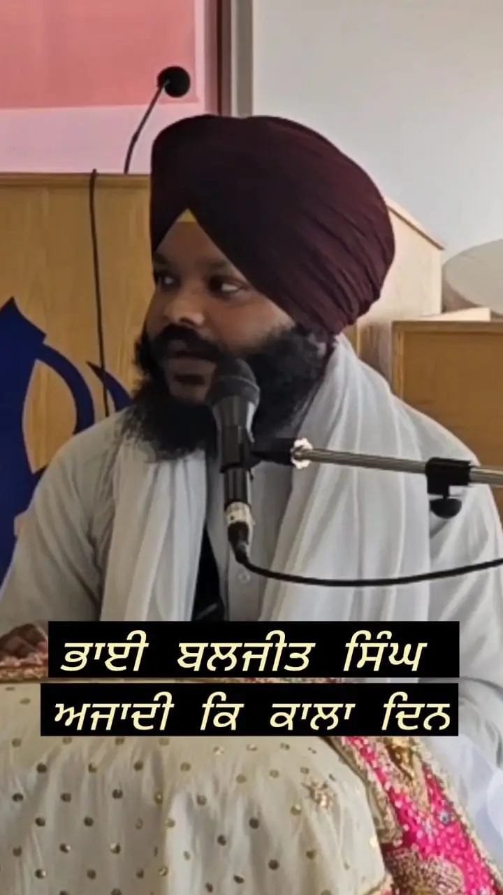 Close-up of a speaker singing into a microphone during service.